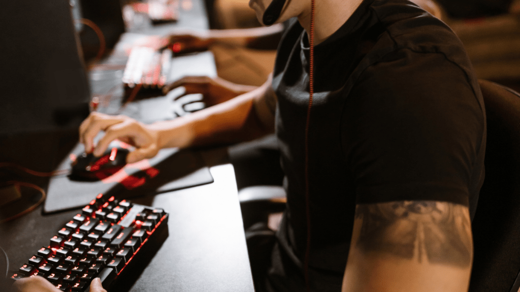 A person wearing headphones is playing a video game