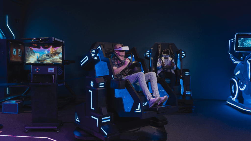 a group of people wearing virtual reality glasses in a dark room