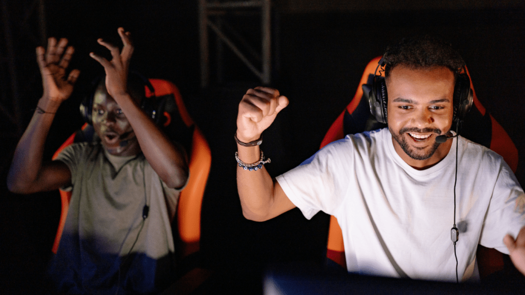 Young men having fun while playing e sports
