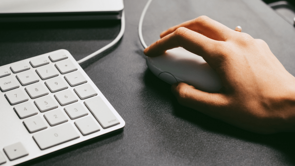 a person using a keyboard and mouse at a gaming event