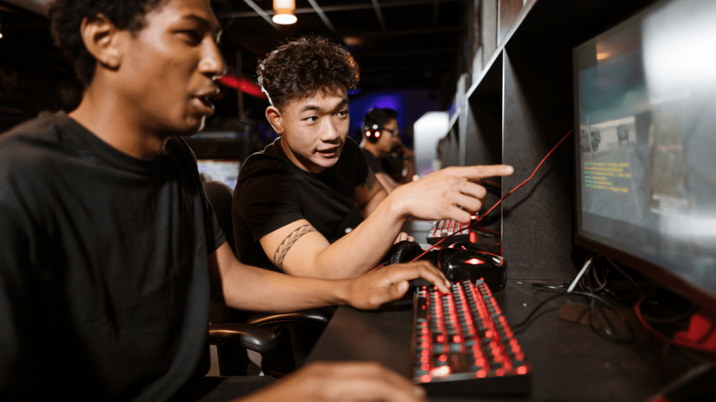 two people playing pc games