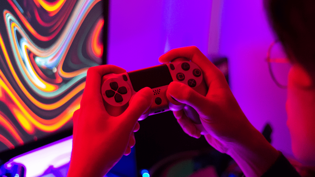 a close up of a person holding a video game controller
