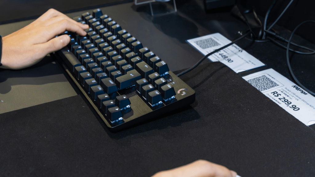 a person using a keyboard and mouse at a gaming event