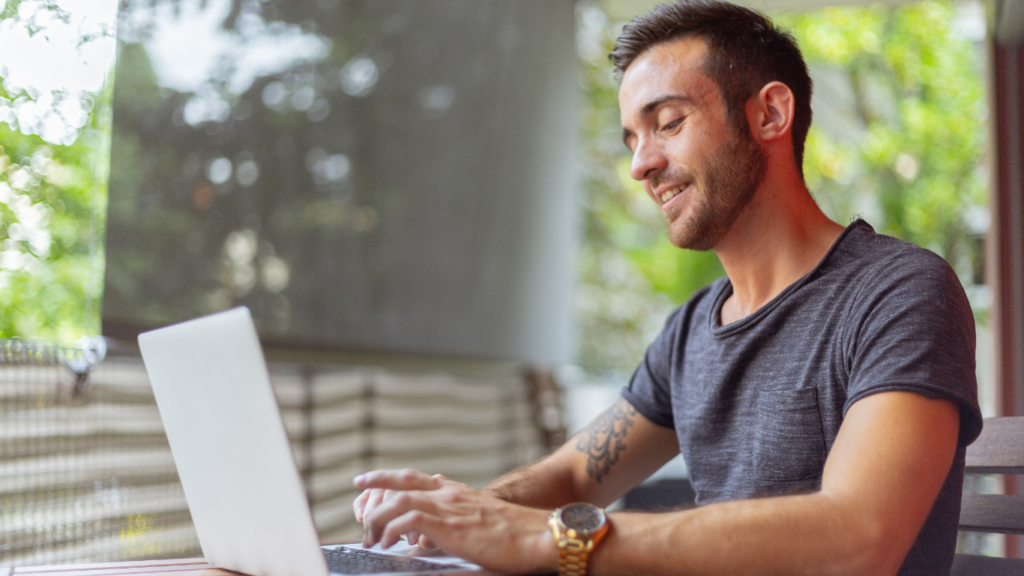 a person using a laptop outdoor