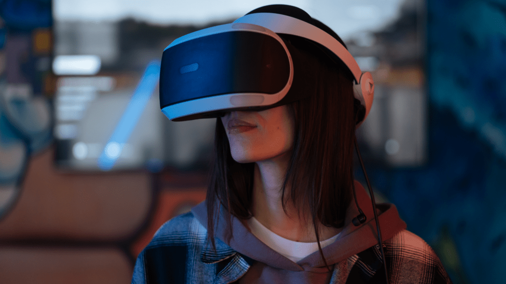a person wearing a virtual reality headset in front of graffiti