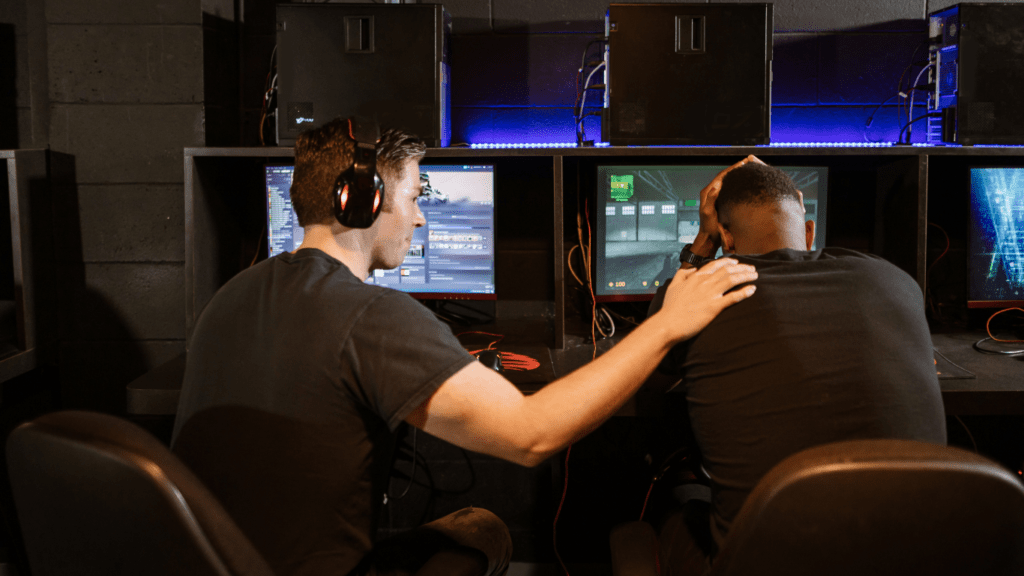 two people playing pc games