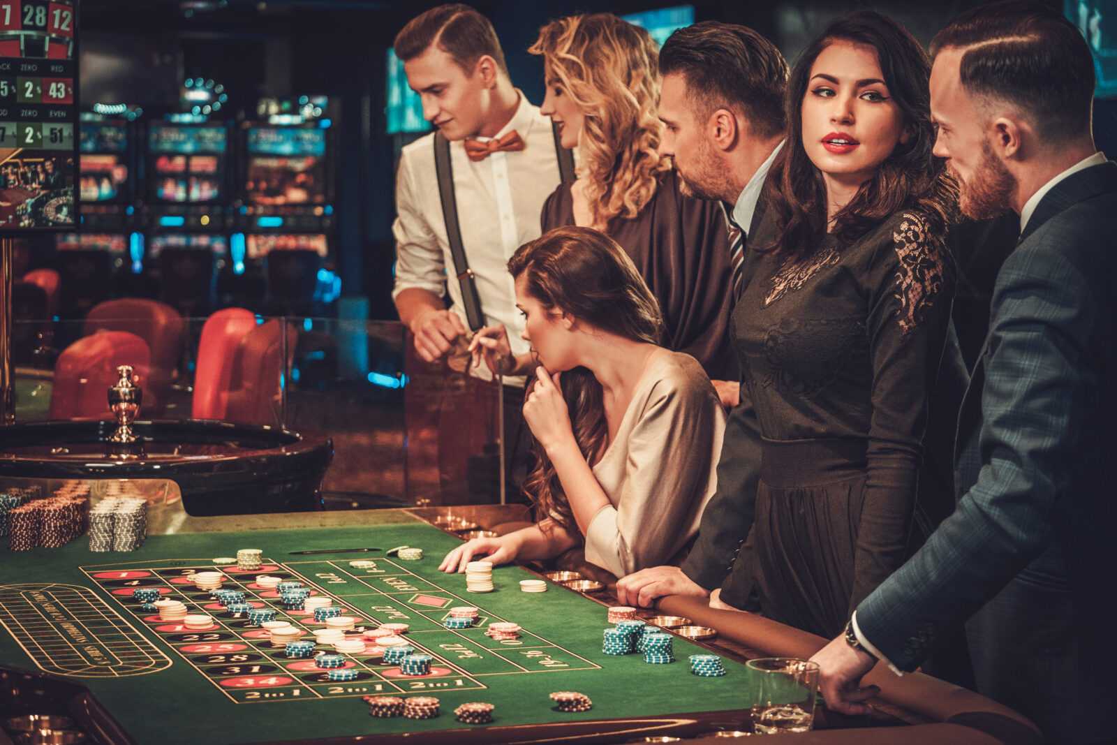 Upper class friends gambling in a casino